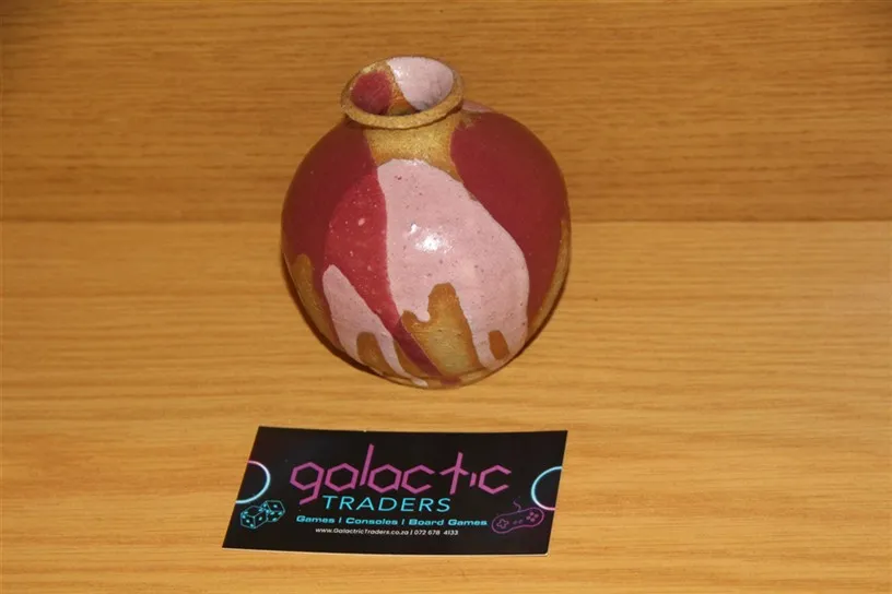 vintage small, round ceramic bud vase with a uniqu. Vintage Small, round ceramic bud vase with a unique, multi-colored glaze in shades of maroon, pink, and tan